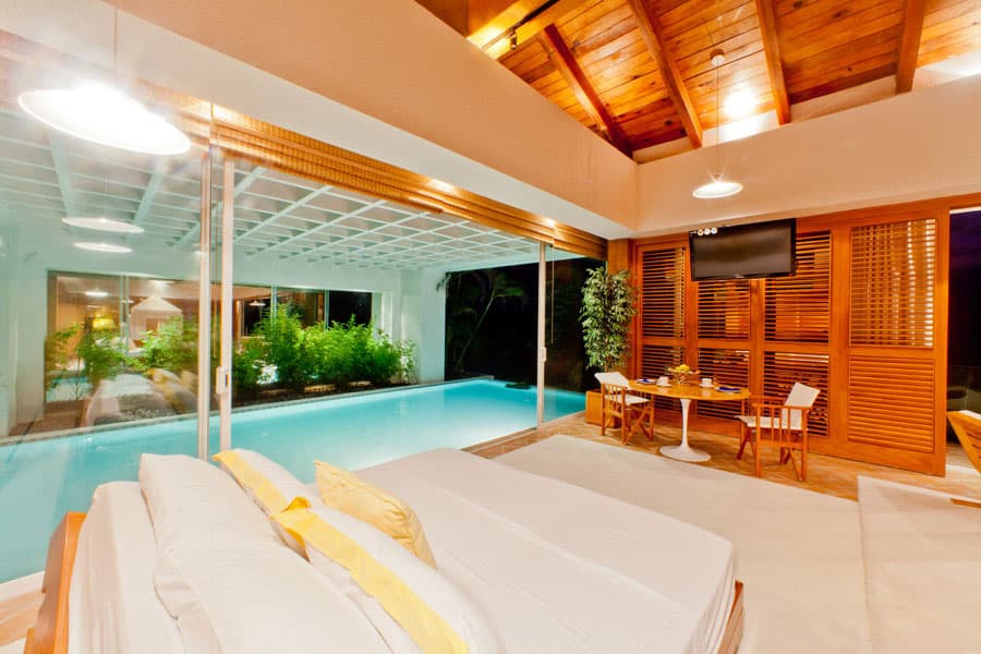 Penthouse lounge and pool at night